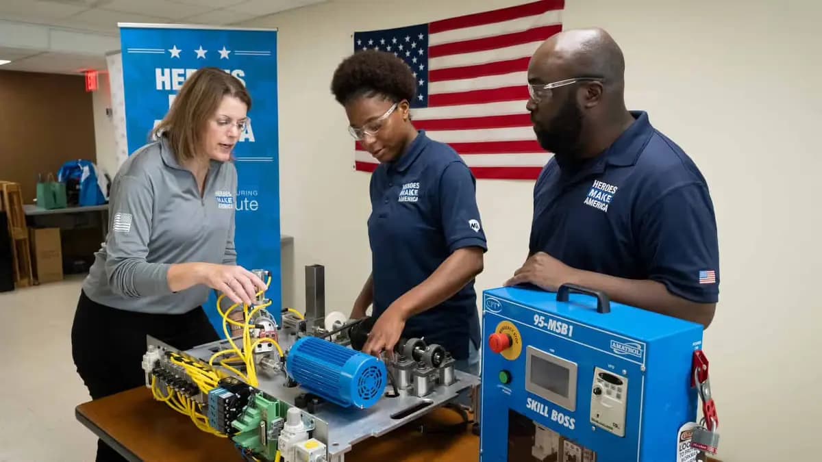 Students receiving hands-on technical training with industrial equipment